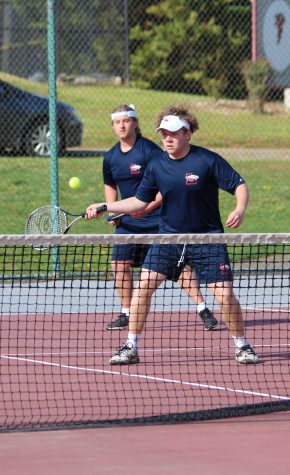 Jonathan Doores and Kenny Rodriguez participate as partners in their doubles match. Photo courtesy of the yearbook staff. 