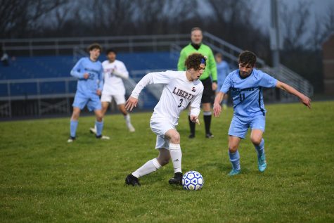 Junior Shawn Garner dribbles the ball in the Eagles matchup against Millbrook. Liberty lost their first game by a narrow margin of 2-1 and the rematch will take place at Eagle Stadium on April 26. Photo courtesy of the yearbook staff. 