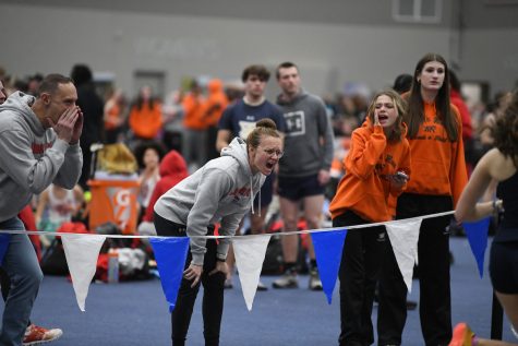 Coach Rodman encourages her runners during district competition. Photo courtesy of the yearbook staff.