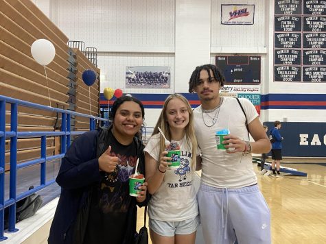 Yacky Meja Reyes, Carolyn Maines and Joseph Minor are enjoying Kona Ice from the truck at the Senior Celebration.  Picture by Angelina Lamb