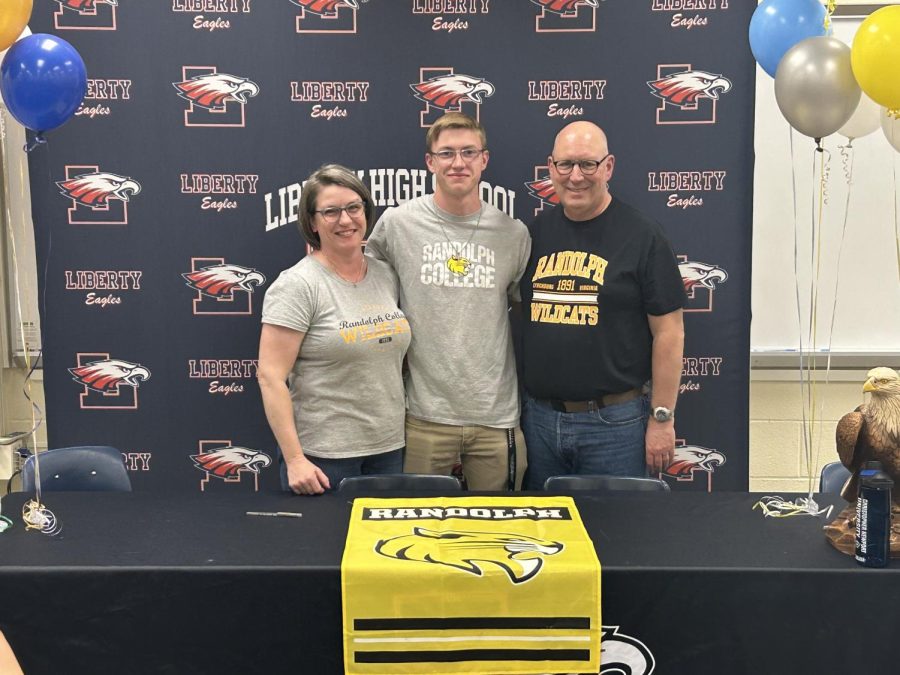 Jackson Arnold signs with Randolph College. Photo courtesy of Amara Collins.